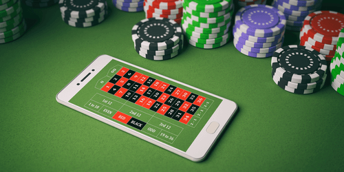 Vetting Android Casinos - Photo of Android Phone on Casino Table 